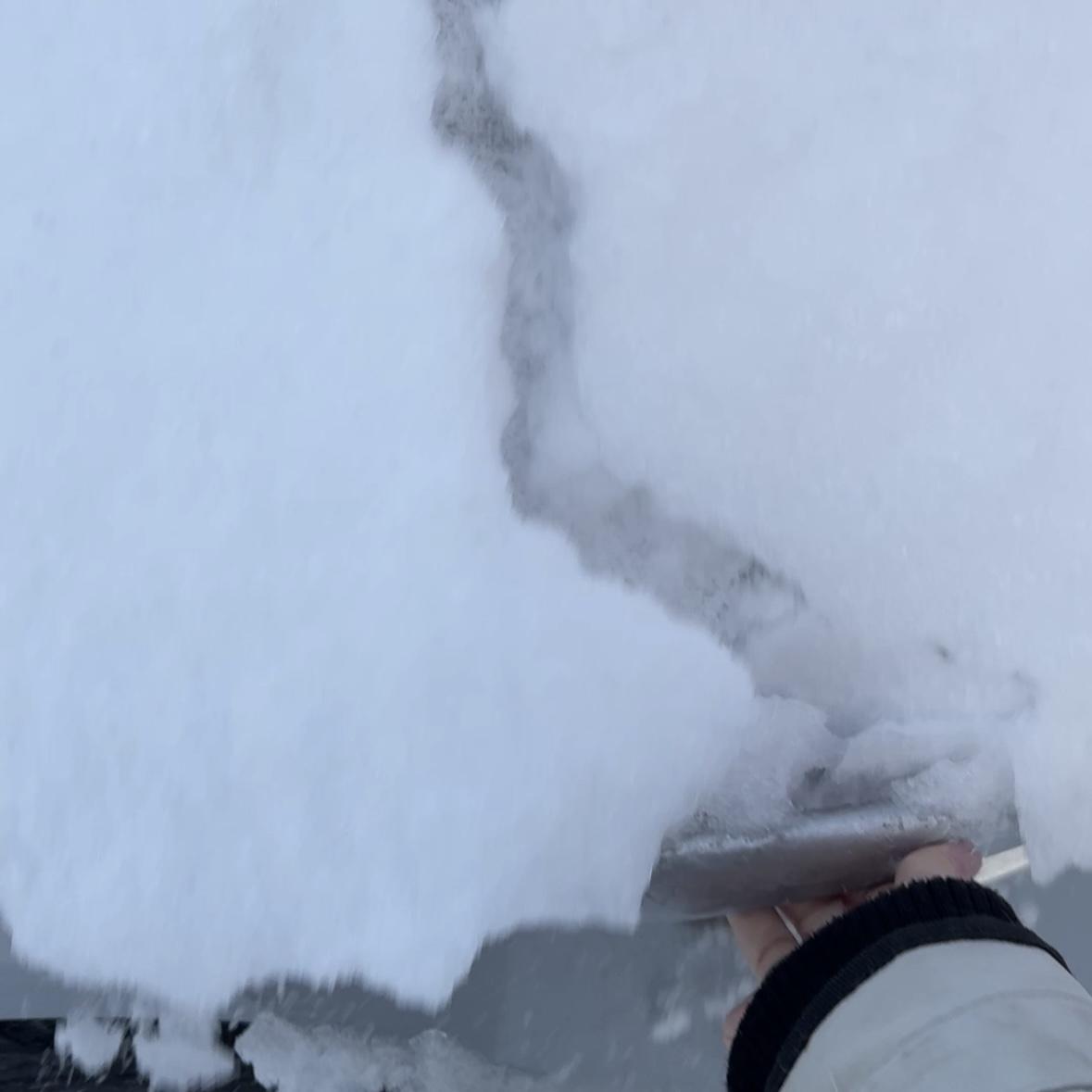 This is my sisters car door which was covered in ice/snow. The sound is me opening the door and all of the ice falling down on to my hand. 