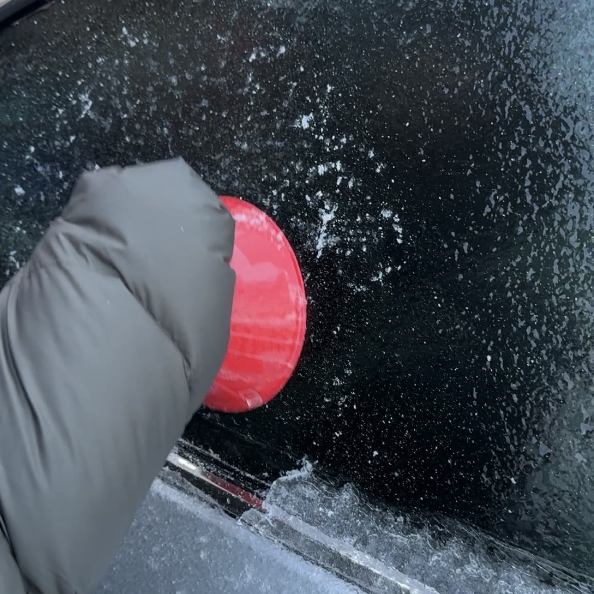 This is a weird ice scraper thing that kind of helps to get ice off your car. The sound is of it being used on the window to get the ice off.