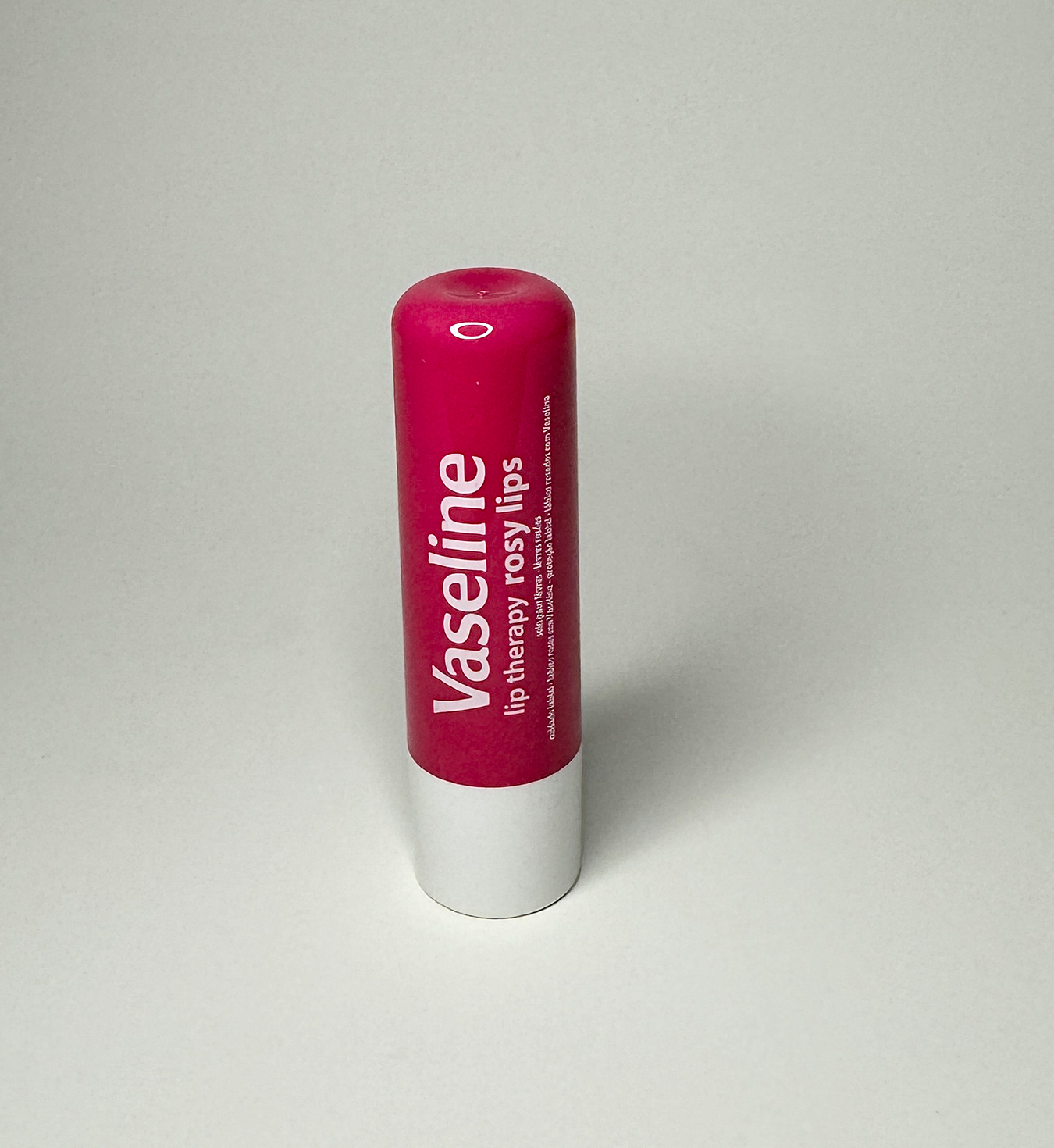 Image of pink vaseline lip balm standing